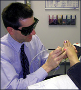 Dr. Schaengold performing laser therapy